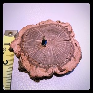 Iolite on gold pendant